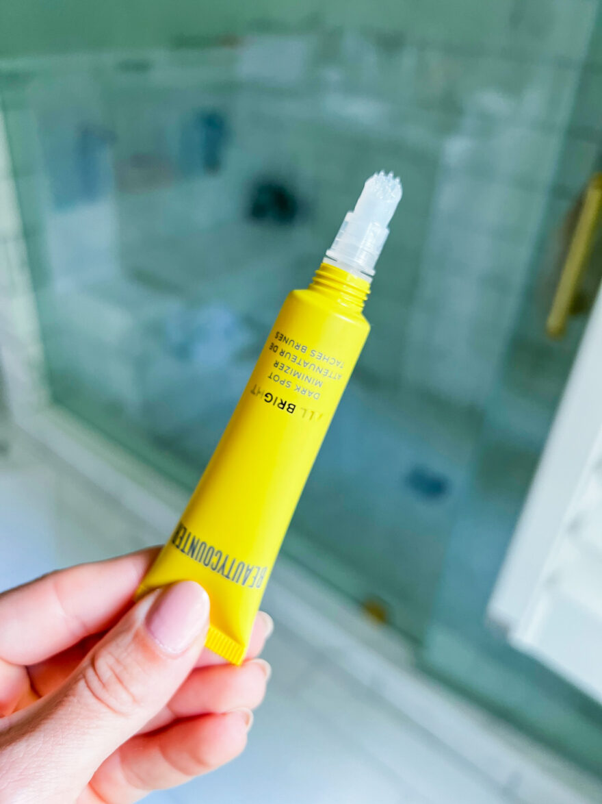 person holding Beautycounter All Bright Dark Spot Minimizer