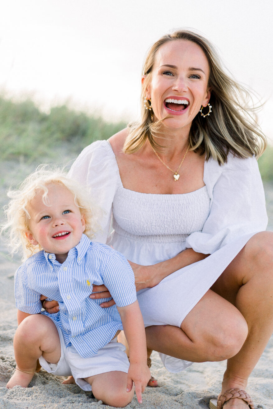 Woman posing with son while wearing the Annie Smocked Dress
