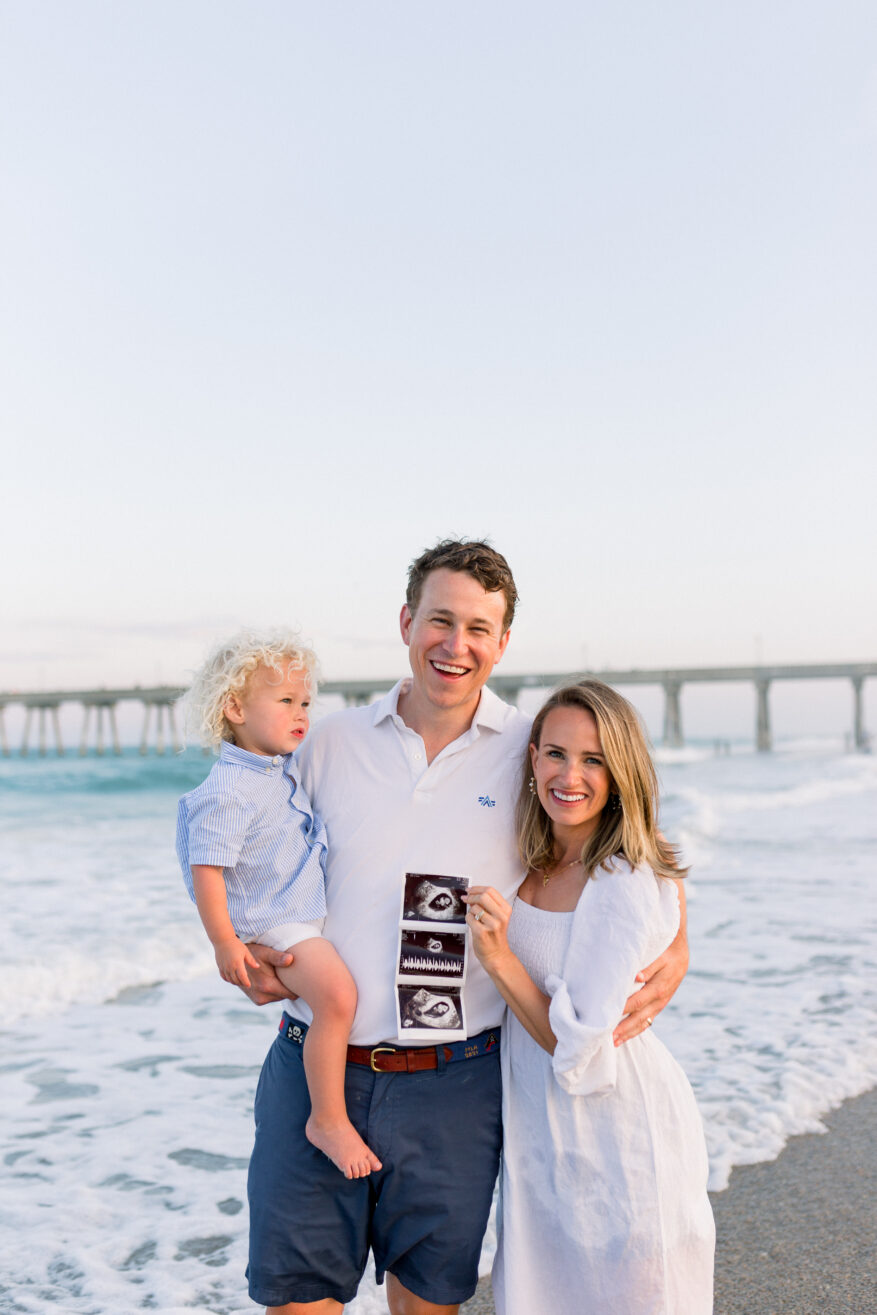 Woman with husband and son wearing the Annie Smocked Dress