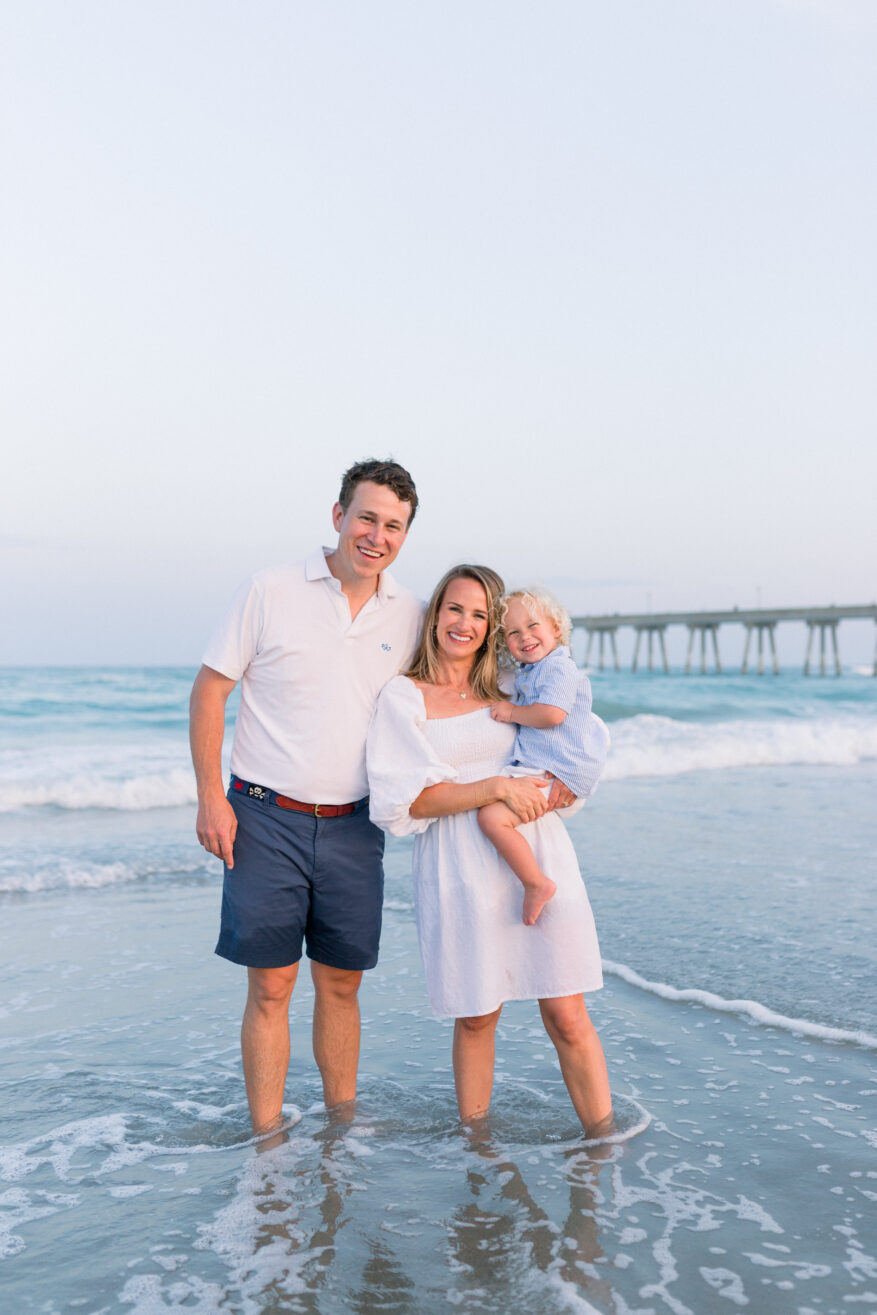 family at the beach wearing breathable fabrics for styling tips for hot weather