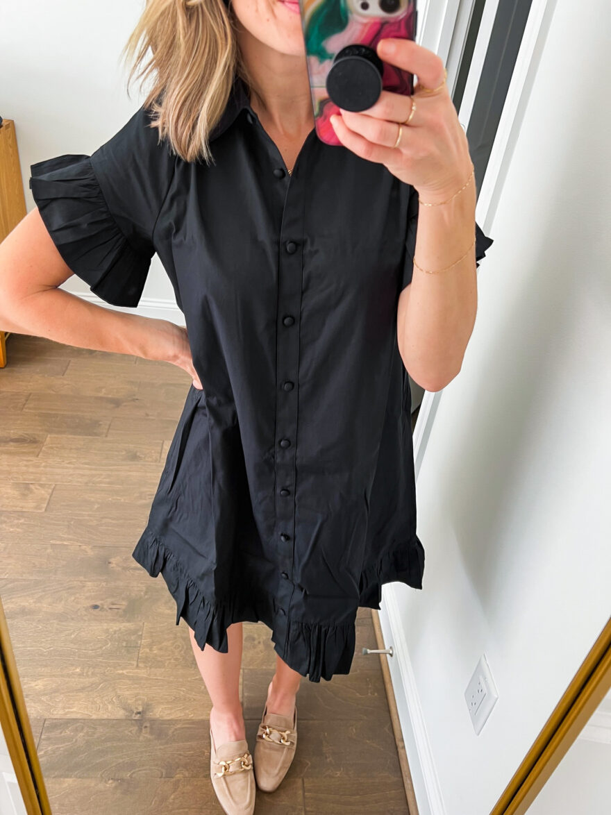woman showing the details of her Ruffle-Hem Shirtdress in Cotton Poplin one of the Best J.Crew Dresses for Fall