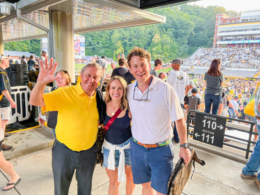TeriLyn Adams with two guys in a football game