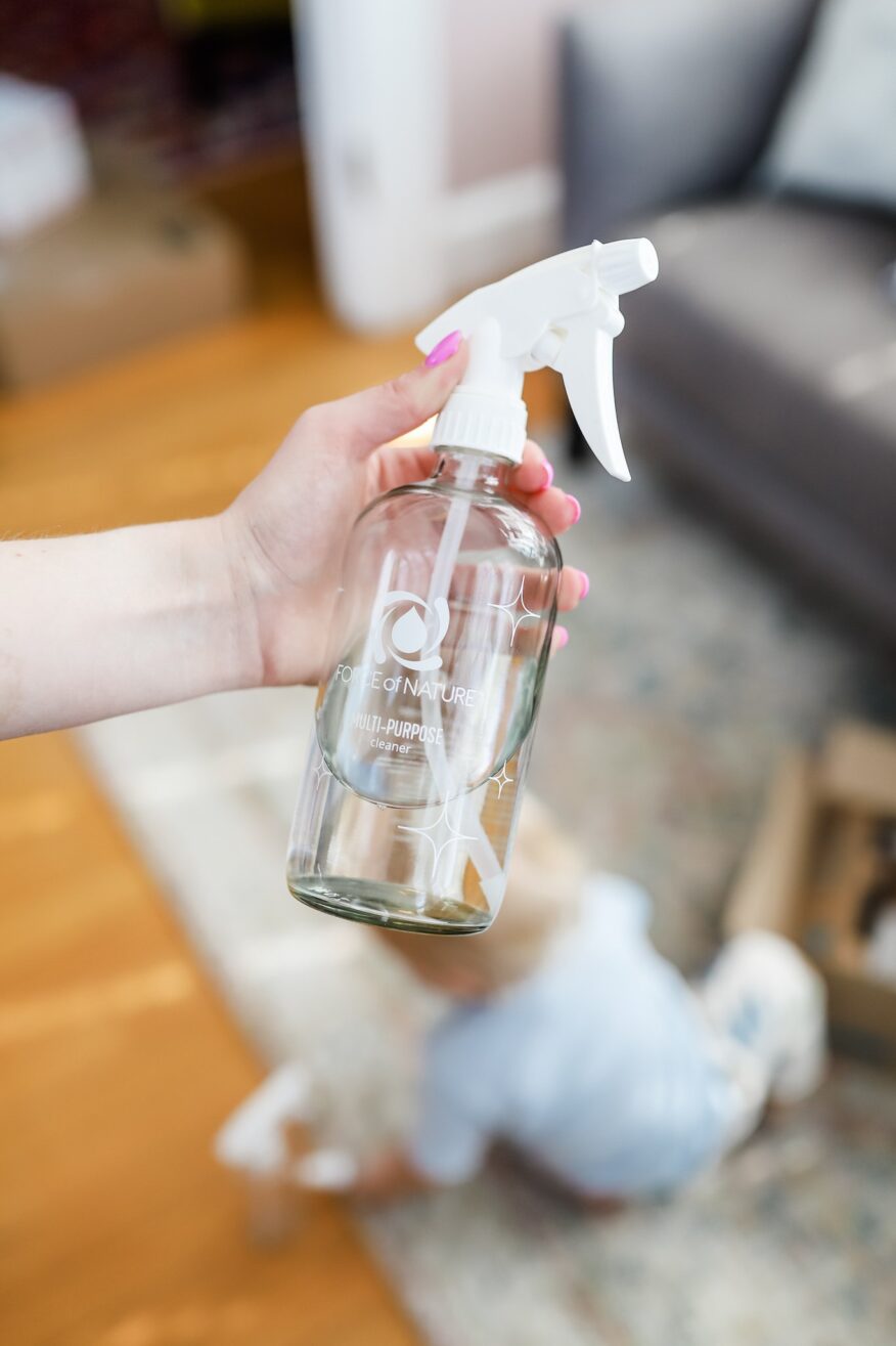 TeriLyn Adams holding a Force of Nature glass bottle as one example of how to organize your life