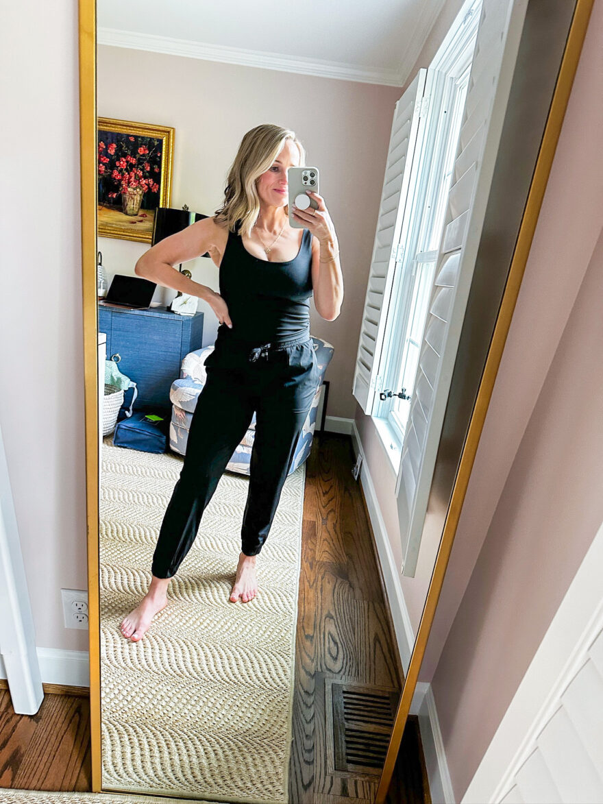 Terilyn Adams wearing the lightweight Fabletics One Joggers with the Oasis Rib Twist Built-in Bra Tank