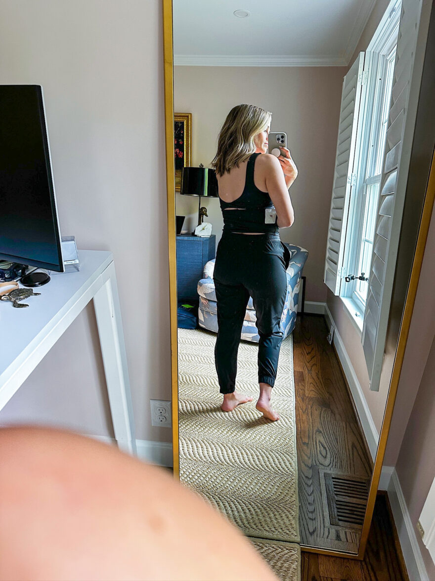 Terilyn Adams wearing the lightweight Fabletics One Joggers with the Oasis Rib Twist Built-in Bra Tank and showing the cute back 
