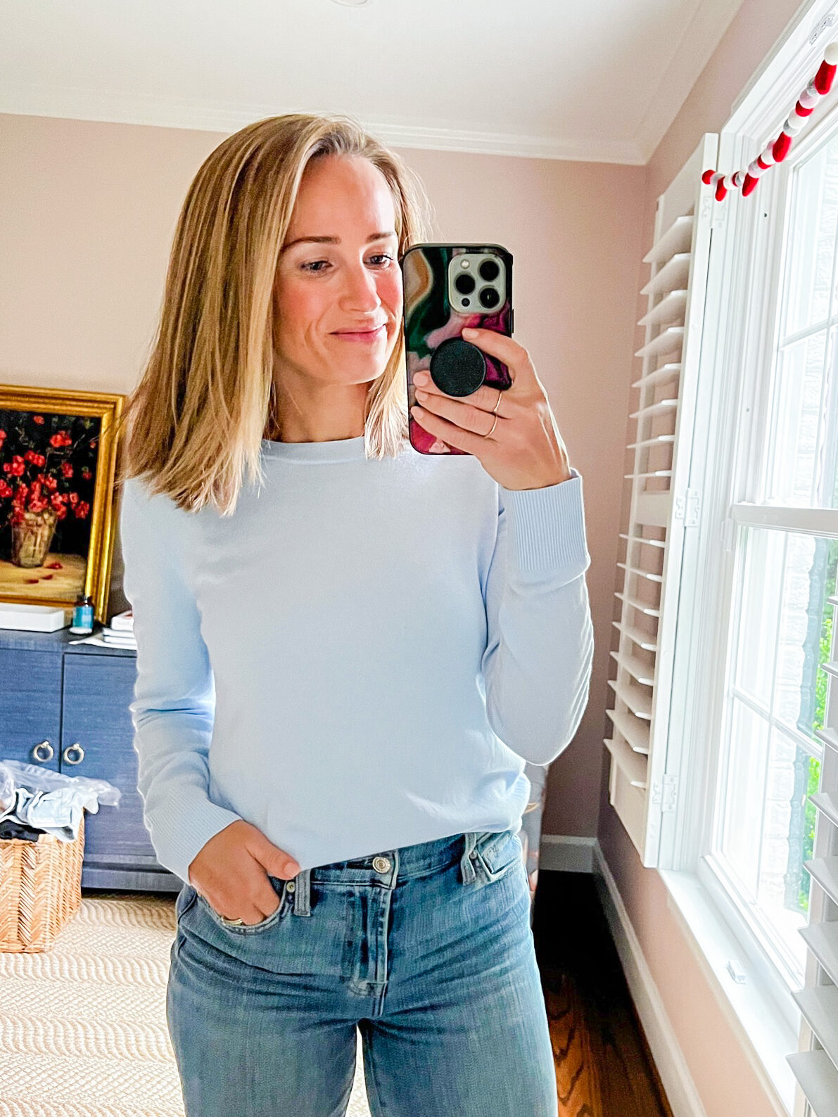 TeriLyn Adams taking a selfie and wearing lightweight sweater