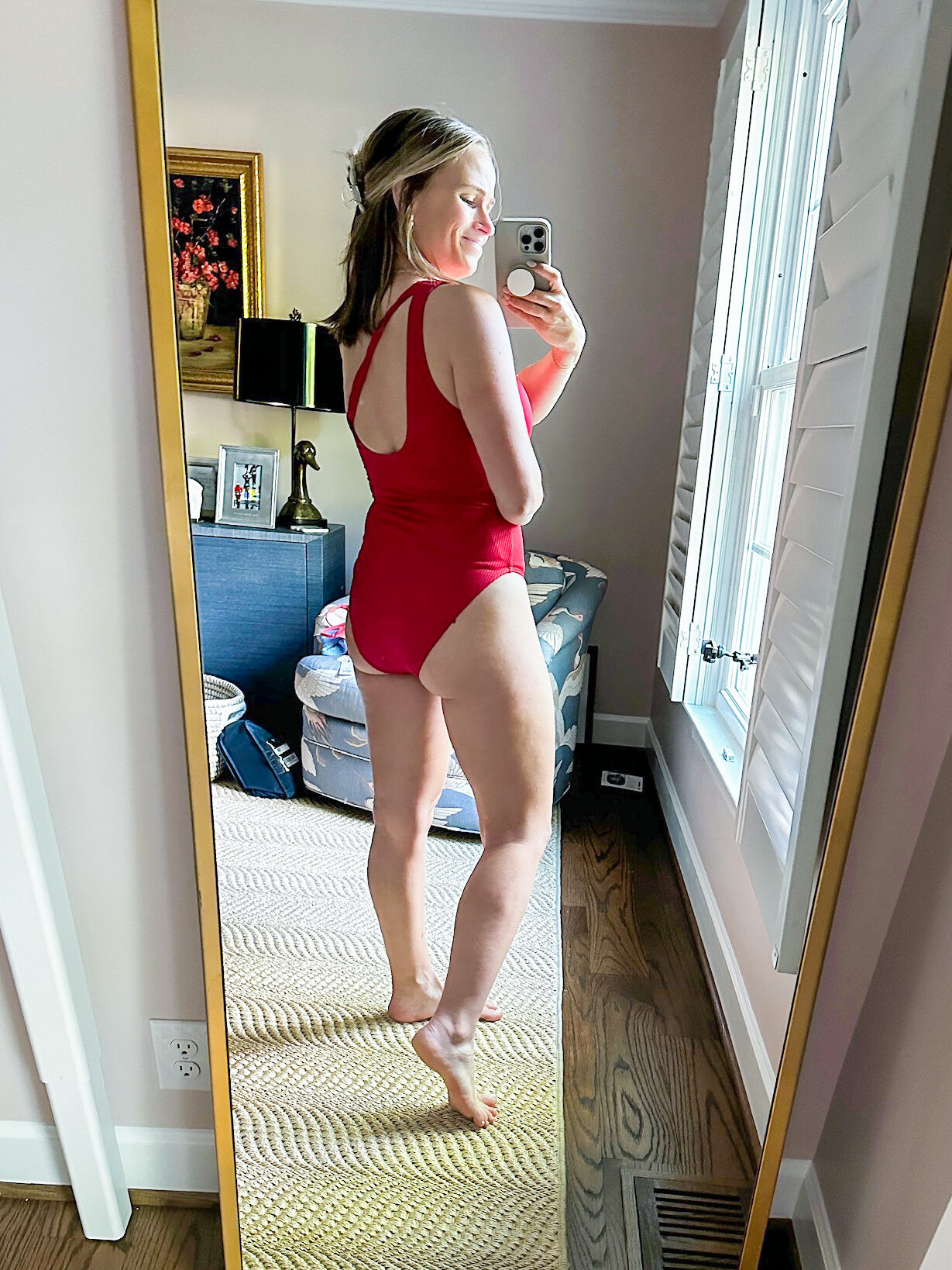 Woman showing back view of Target swimsuit