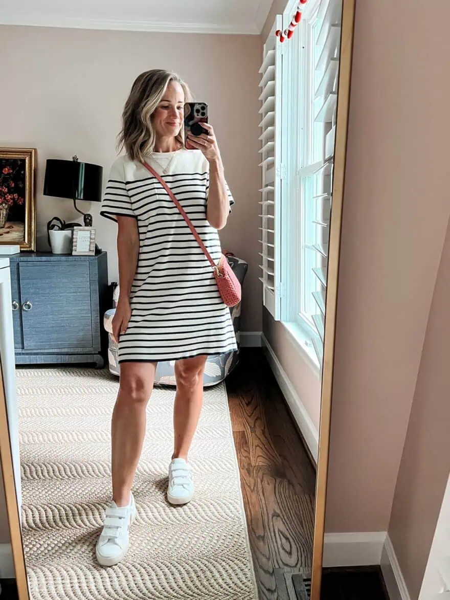 Woman modeling Tuckernuck's Navy Knit Striped Frenchie Dress